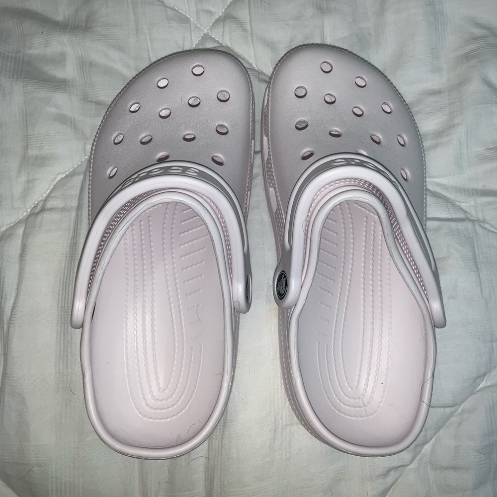 White pair of women’s crocs size 6 or men’s size 4